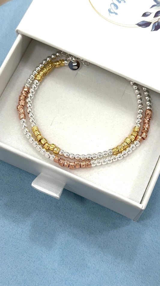 Bracciale sfere e sassolini puntellati